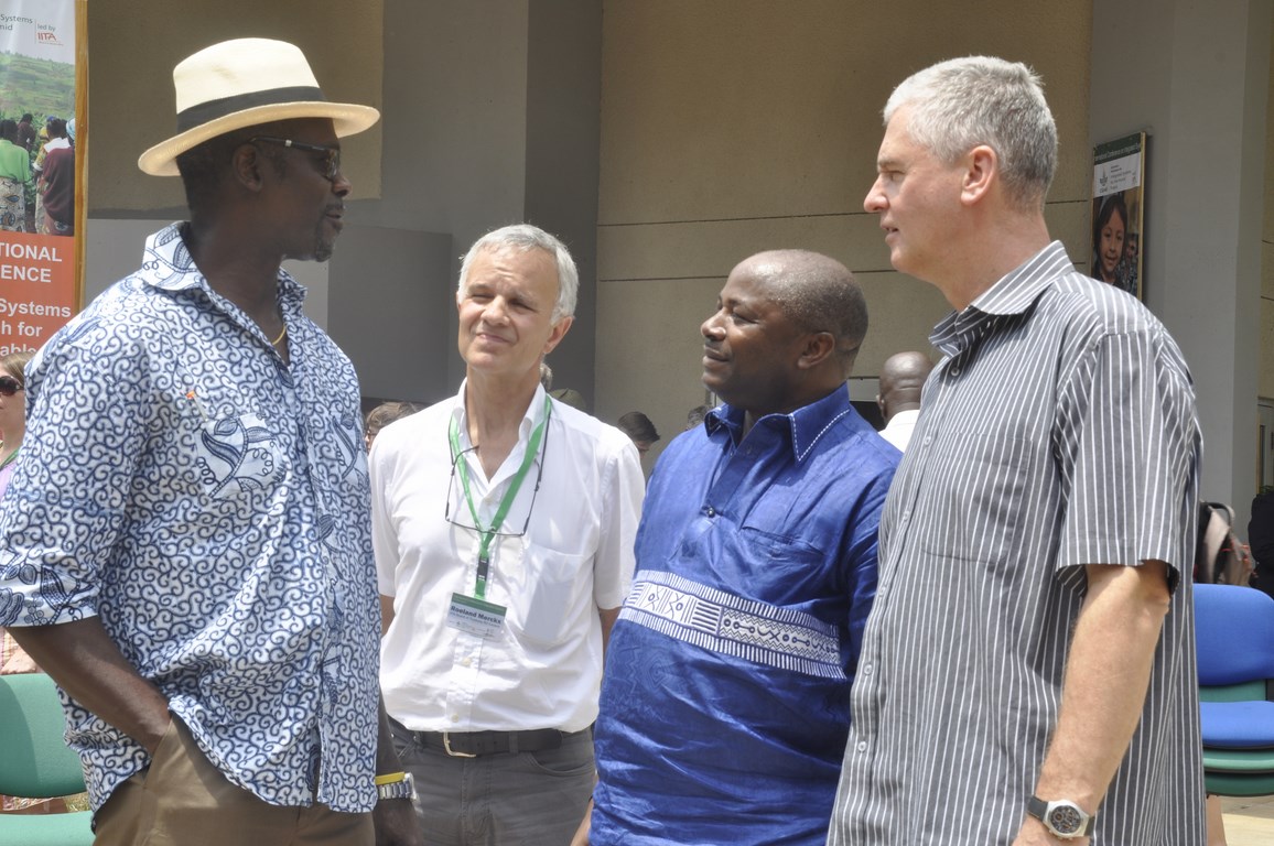 Frank Rijsberman (rightmost) in a huddle with (L-R) Dr Kwesi Attah-Krah, IITA Board Member Roel Merckx, and DG Nteranya Sanginga after the meeting in Ibadan.