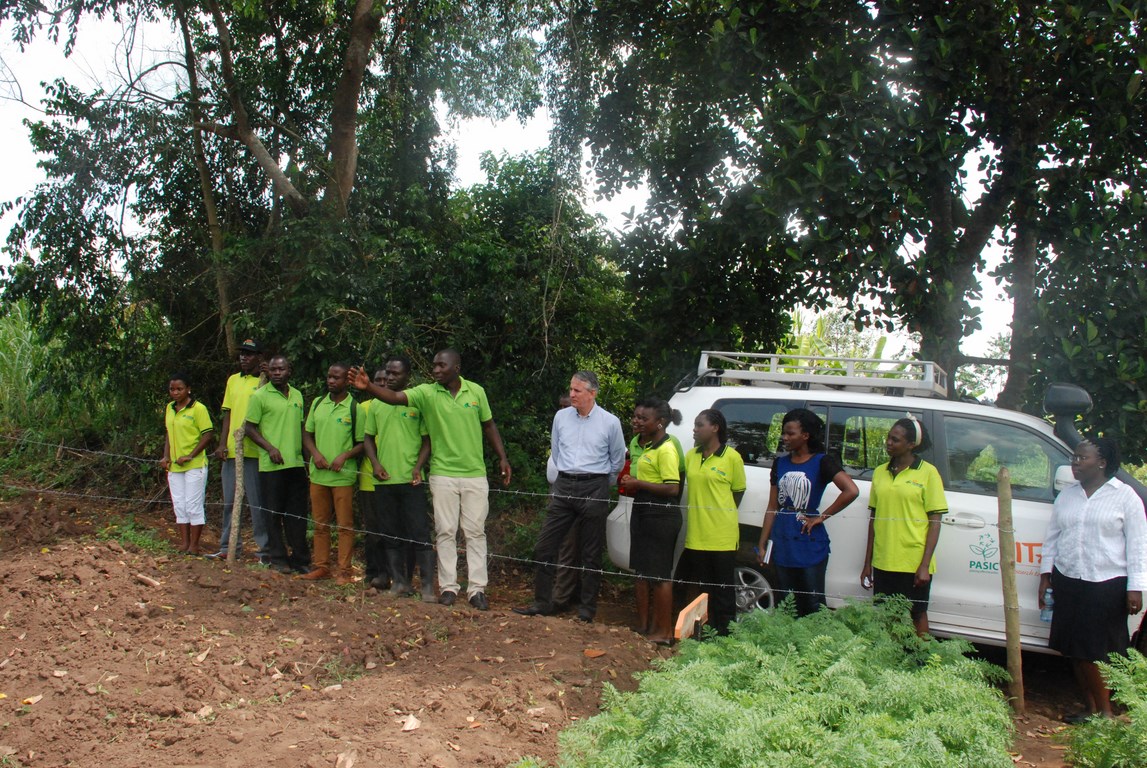The Uganda Youth Agripreneurs showing Dr Peter Blomeyer around their farm.