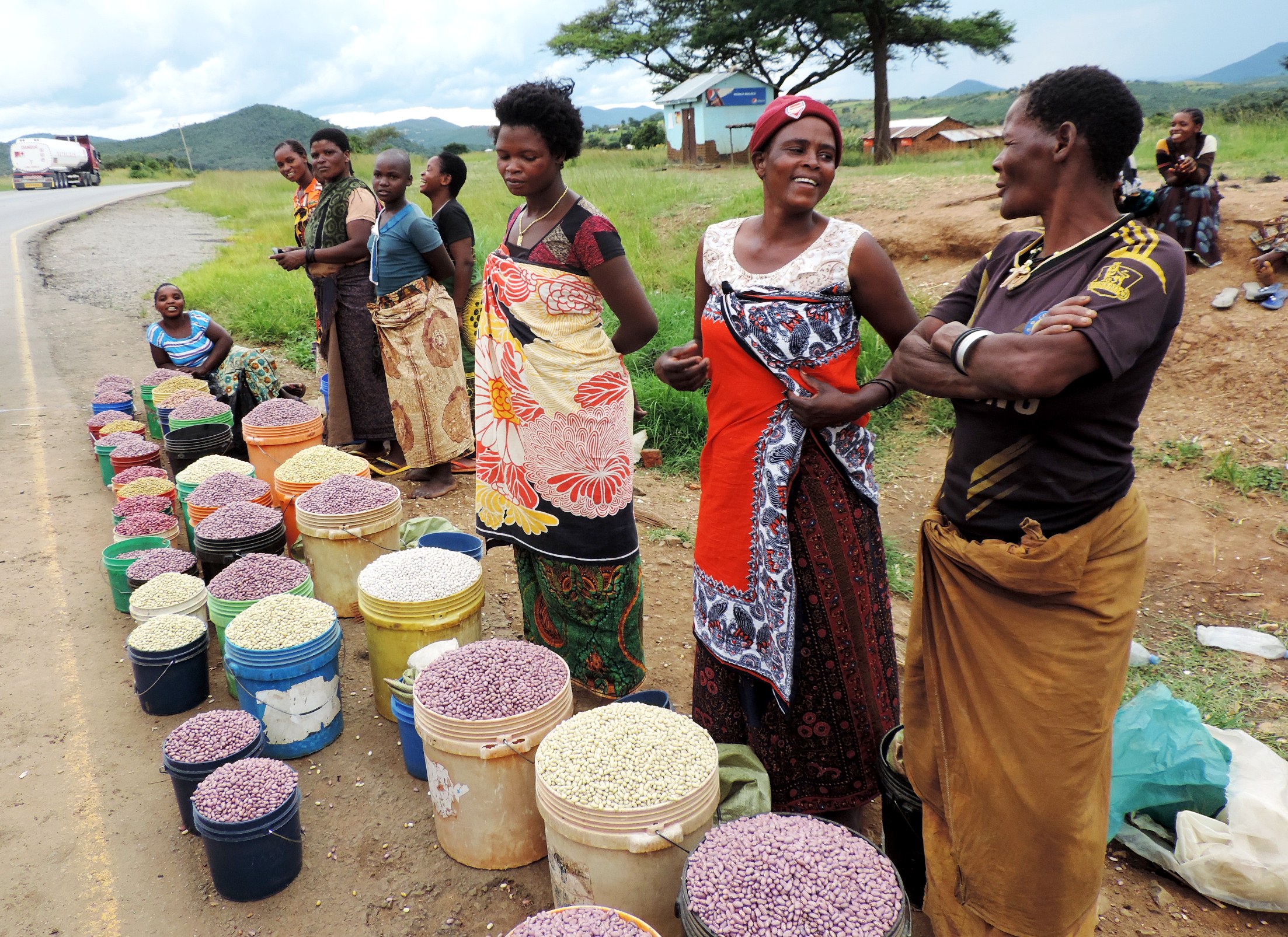 Women selling an assortment of beans on the roadside in Mbeya, southern Tanzania