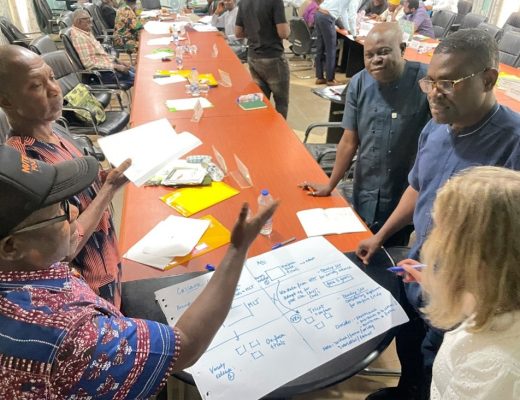 The joint IITA and NRCRI cassava breeding team discussing the integration of tricot on-farm testing within the variety release procedure during a collaborative seed program project meeting at NACGRAB, Ibadan (Photo: Béla Teeken).