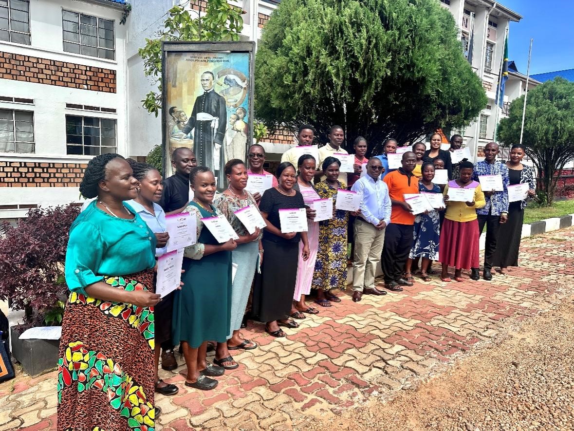 KST staff proudly displaying their certificates after completing the training. Photo credit: Sarah Msita