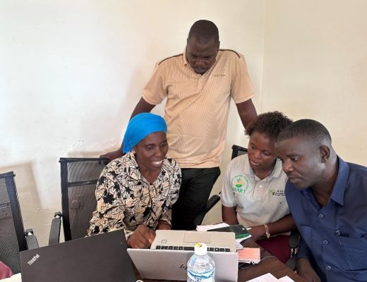 NYDT staff engaged in a dynamic group discussion during mid-training. Photo credit: Sarah Msita