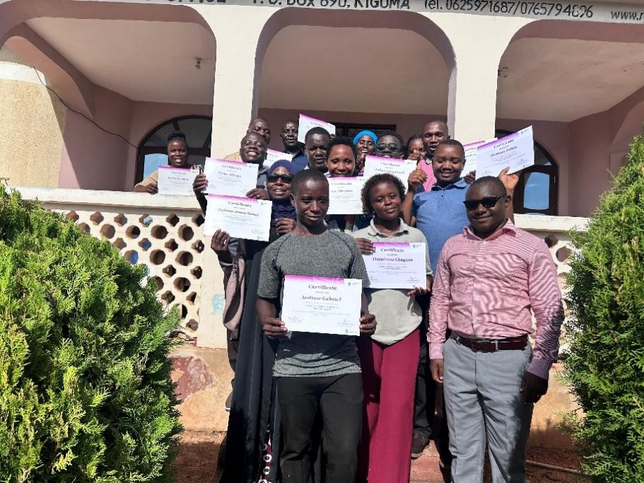 NYDT participants proudly displaying their certificates after completing the training. Photo credit: Sarah Msita