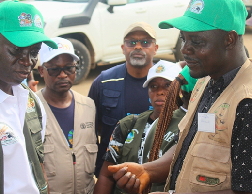 Facilitators and surveyors pose for a photo after