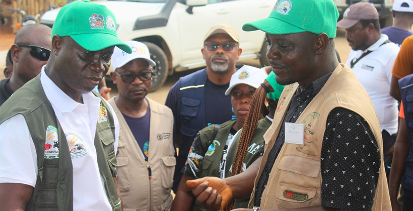 Facilitators and surveyors pose for a photo after
