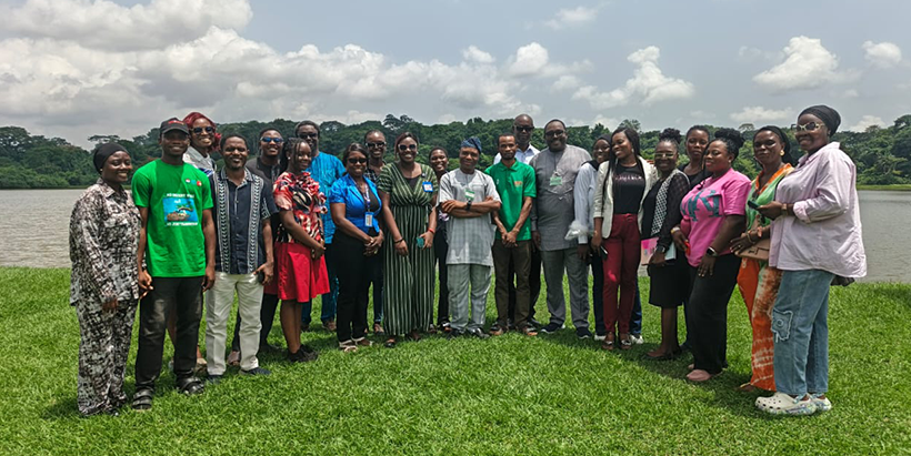 University of Ibadan sustainability leaders pose by the iconic IITA Lake following an insightful tour showcasing IITA’s environmental conservation initiatives.