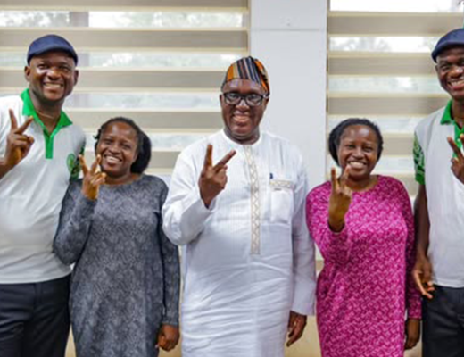 IITA Director General Dr Simeon Ehui with the Oguntoye twins at IITA Headquarters.