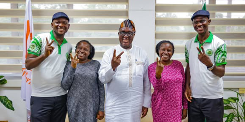 IITA Director General Dr Simeon Ehui with the Oguntoye twins at IITA Headquarters.