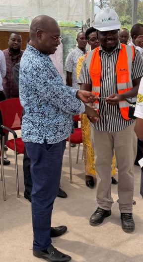 Solar Nation handing over the screen/glasshouse keys to Dr P. Mutuo, the Country Representative of IITA-Burundi.