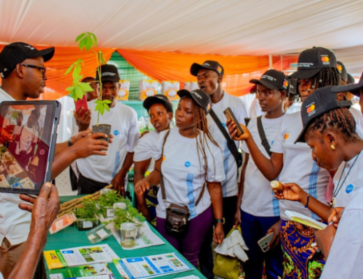 IITA Rwanda staff Charles Mwizerwa explains the cassava value chain to visitor farmers at the Rwanda Agrishow 2026.