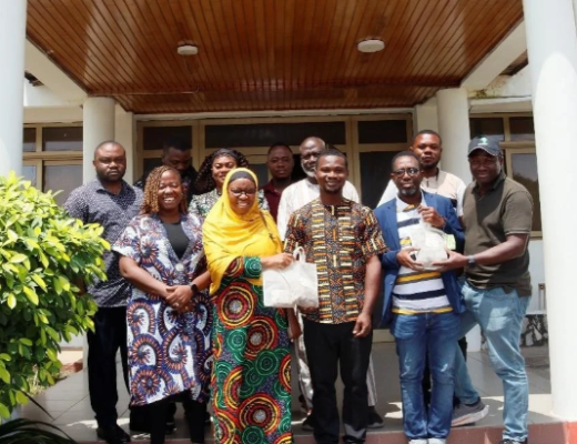 Participants during the Early Generation Seed engagement meeting in Accra, Ghana. Prof. Morufat Balogun, IITA (2nd left) and Dr Djana Mignouna, IITA (1st right) handing over the yam seeds to Dr Kwabena Darkwa, SARI (middle) and Dr Victor Acheampong Amankwaah (2nd right).
