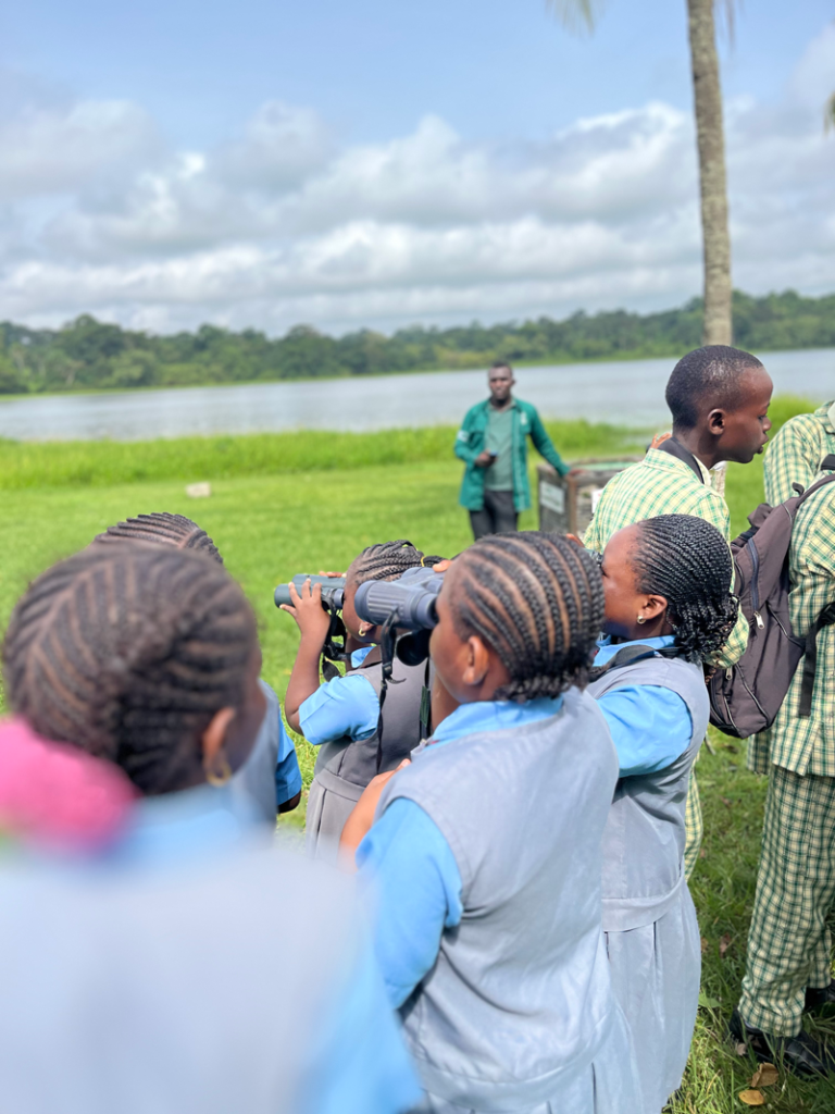 A student spots a migratory bird for the first time during World Migratory Bird Day activities at IITA. Photo: Ogheneovie Kome