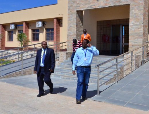 Picture of David Chikoye (right) giving DG Sanginga a tour of IITA SARAH’s main research and administration block