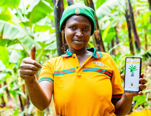 Farmer holding a mobile smart phone