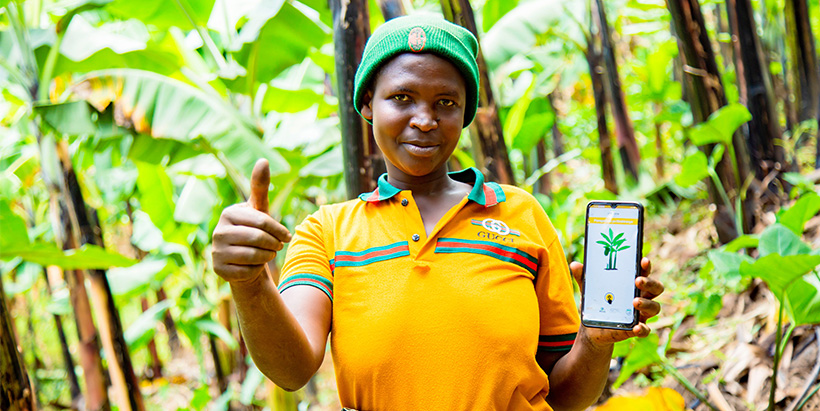 Farmer holding a mobile smart phone